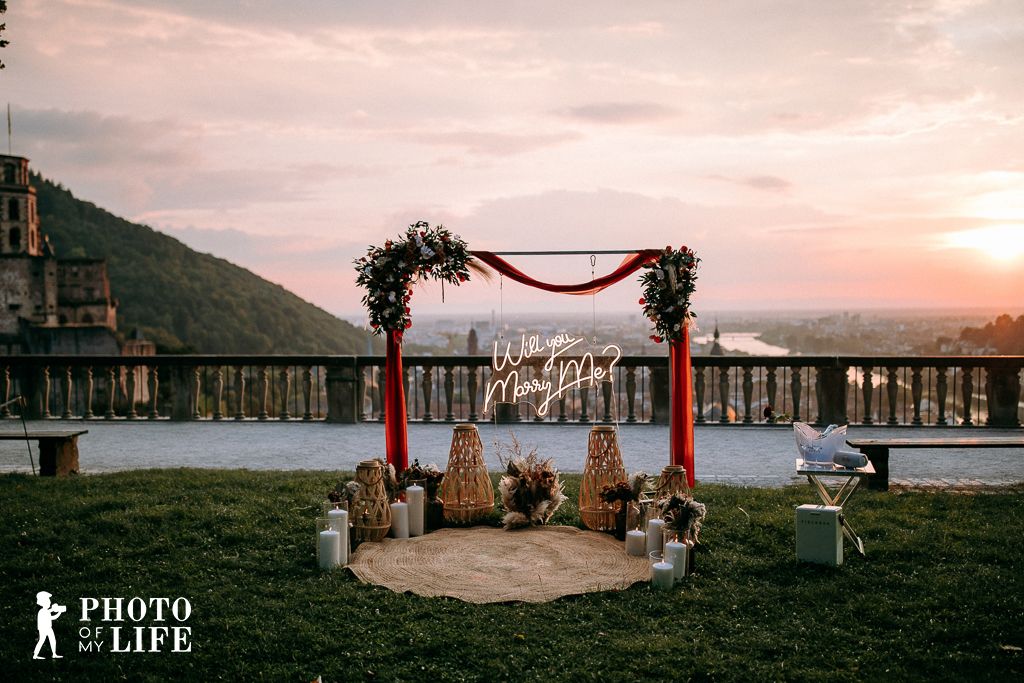 Boho Love proposal decoration at castle at sunset – romantic flower arrangement