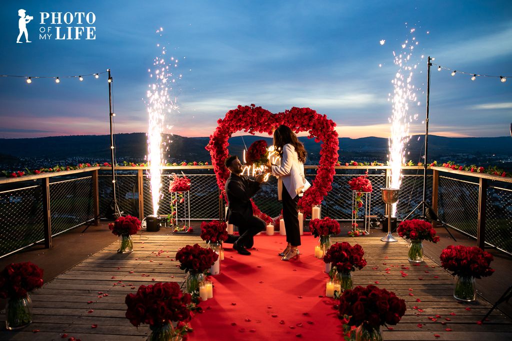 Dream of Roses marriage proposal on rooftop with fireworks – man kneeling with ring