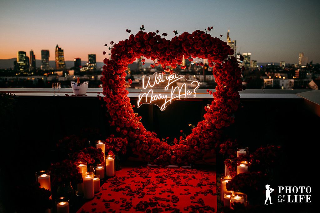 Dream of Roses proposal – rose heart with city skyline and Will You Marry Me neon sign