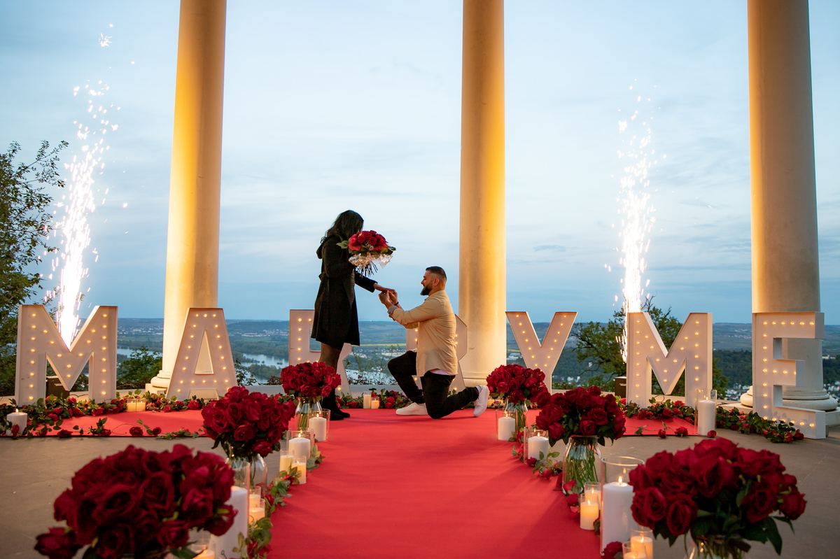 Marriage proposal at Niederwaldtempel – fireworks with man kneeling and Rhine valley panorama