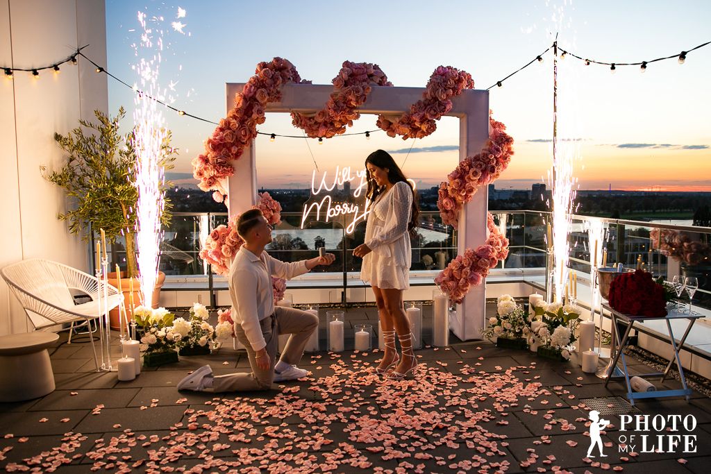 Temple of Love proposal on rooftop – couple with romantic city skyline panorama