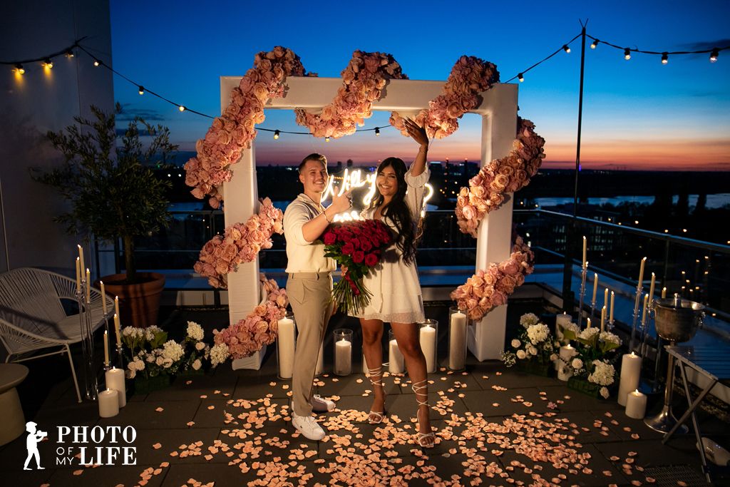 Temple of Love rooftop proposal – man kneeling for partner with fireworks display
